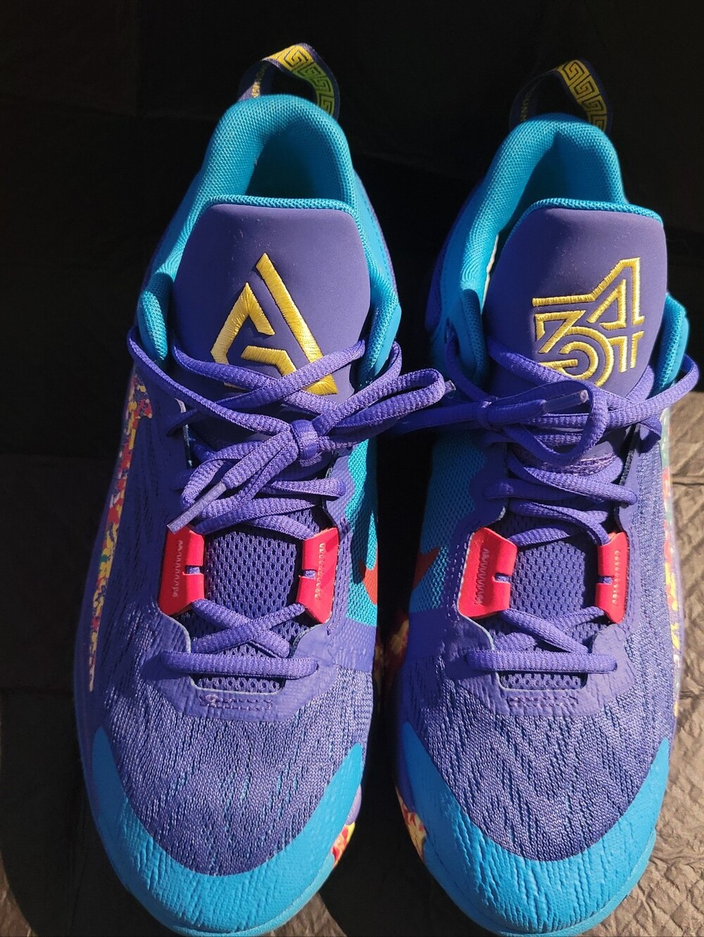 Nike Giannis Immortality 2 Lapis sneakers in a vibrant purple and blue colorway.